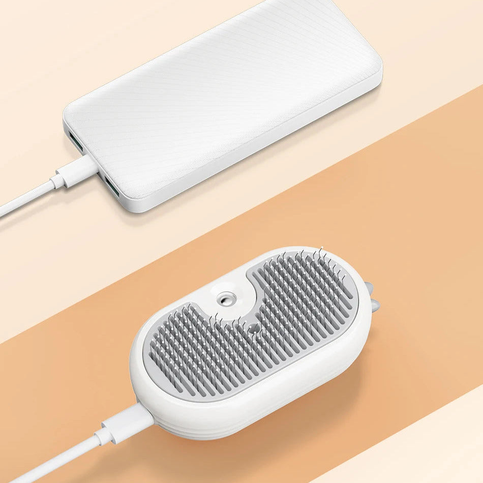 Escova SteamPaw a carregar por cabo USB ligado a uma bateria externa